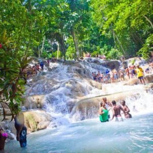 Dunn’s River Falls Tour in Jamaica with a group of people walking a human chain.