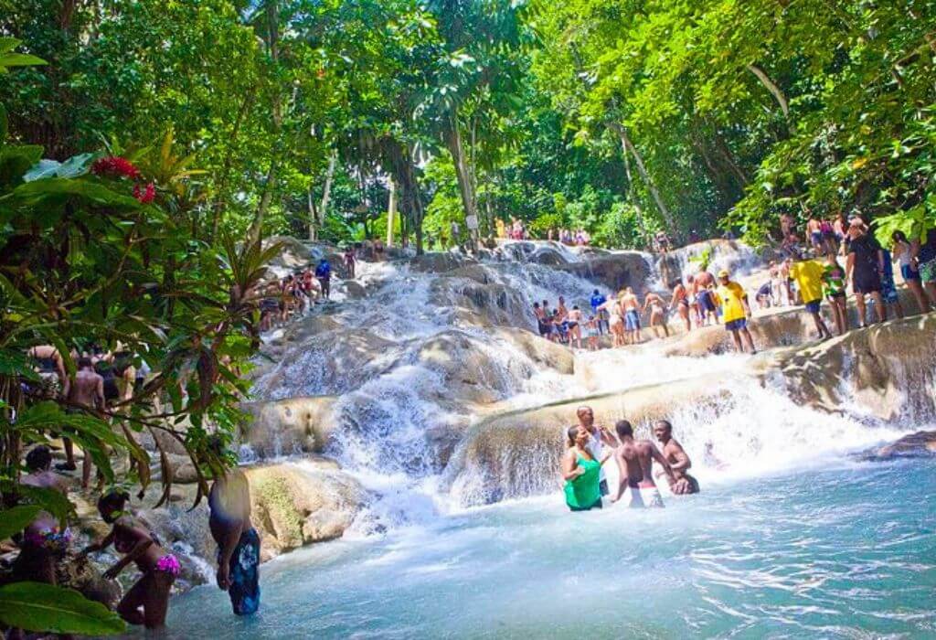 Dunn’s River Falls Tour in Jamaica with a group of people walking a human chain.